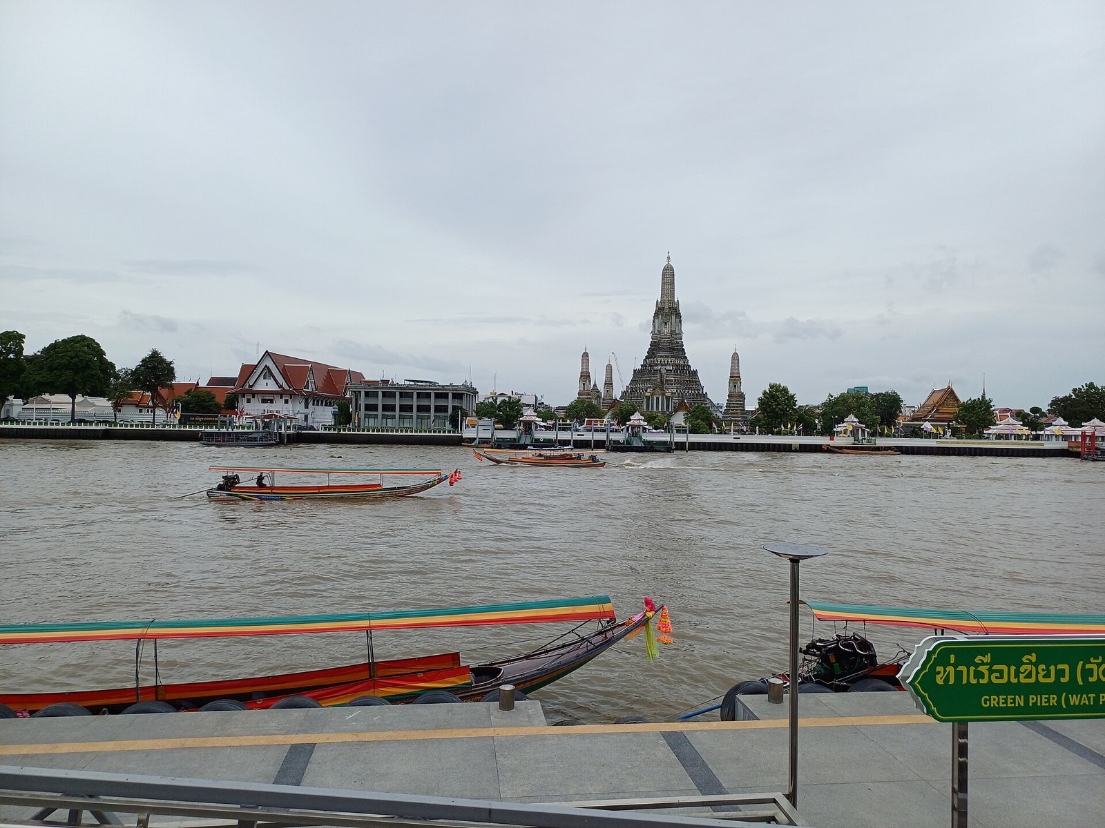 Wat Arun seen across the Chao Phraya from a passing boat