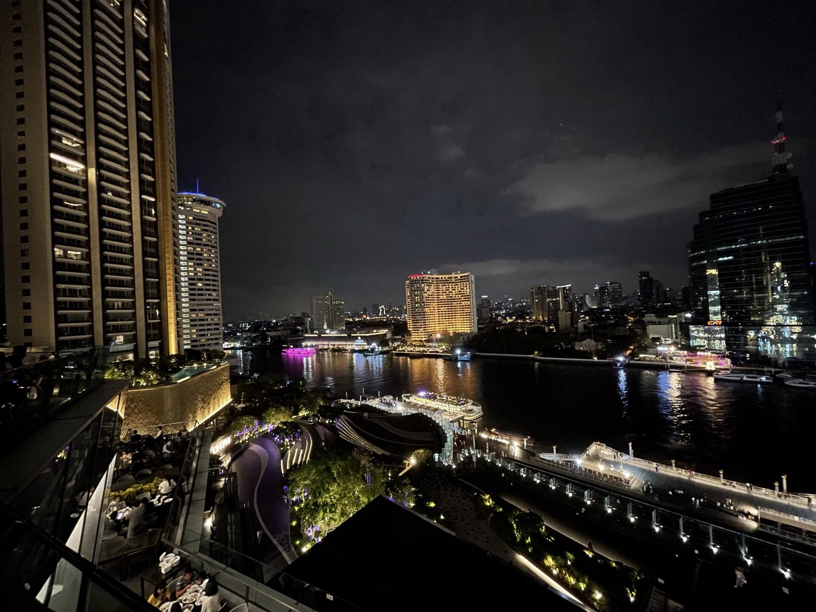 Boats and riverside lights on the Chao Phraya at night, Bangkok