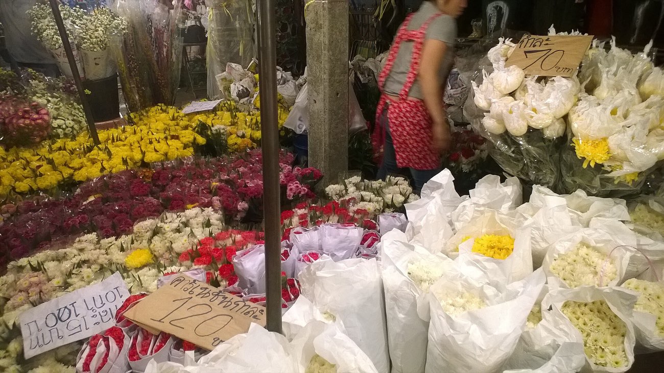 Flower stalls piled with marigolds at Pak Khlong Talat market, Bangkok